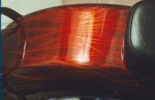 Marblized Orange Candy basecoat with pinstriped silver leaf tribal flames, candy orange layered over leaf.