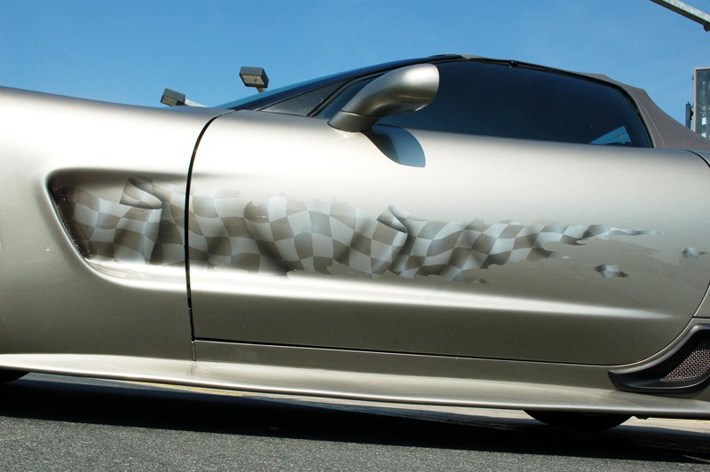 Corvette with checkered flag graphic.
